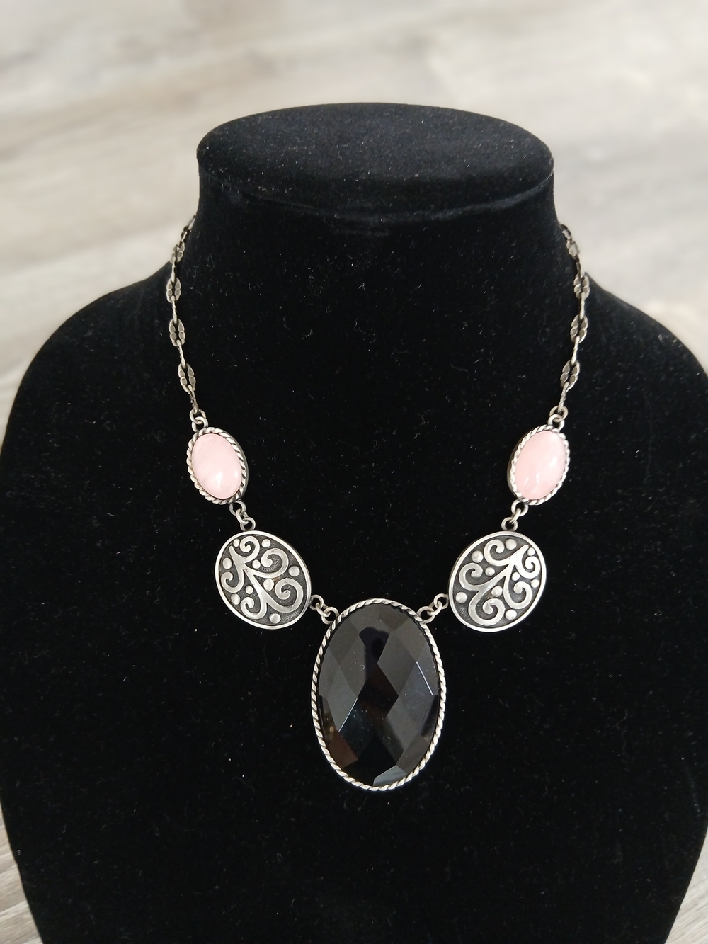 Silver-Tone Necklace with Black Faceted Pendant and Pink Cabochons